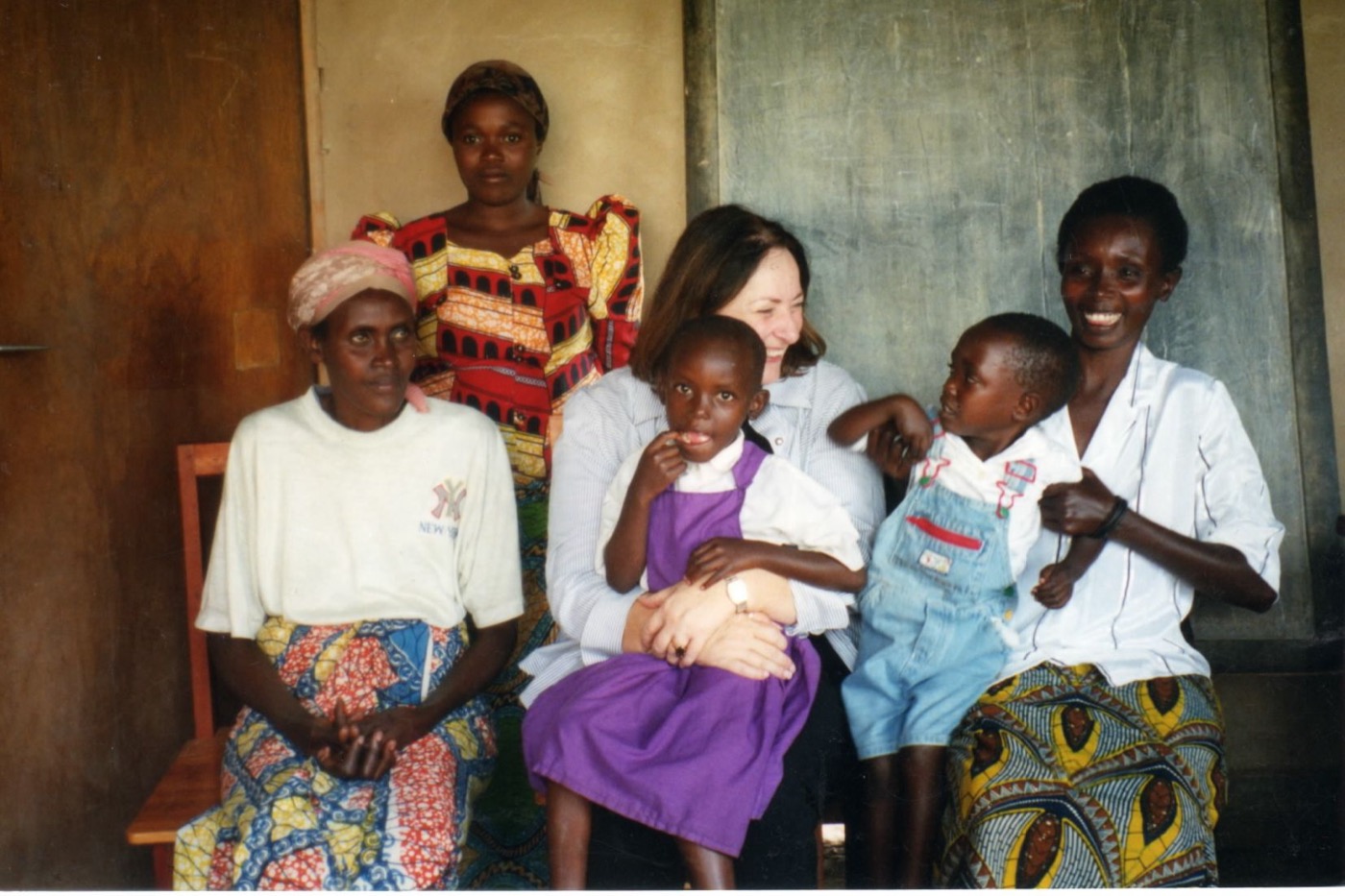 Linda Volkmar laughing with women and children of Rwanda