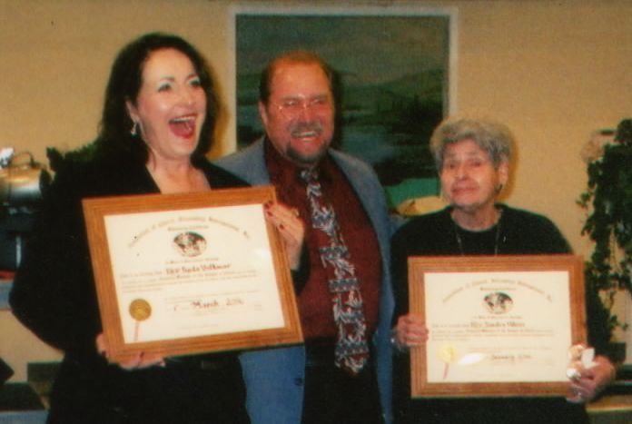 Linda Volkmar receiving her ordination certificate